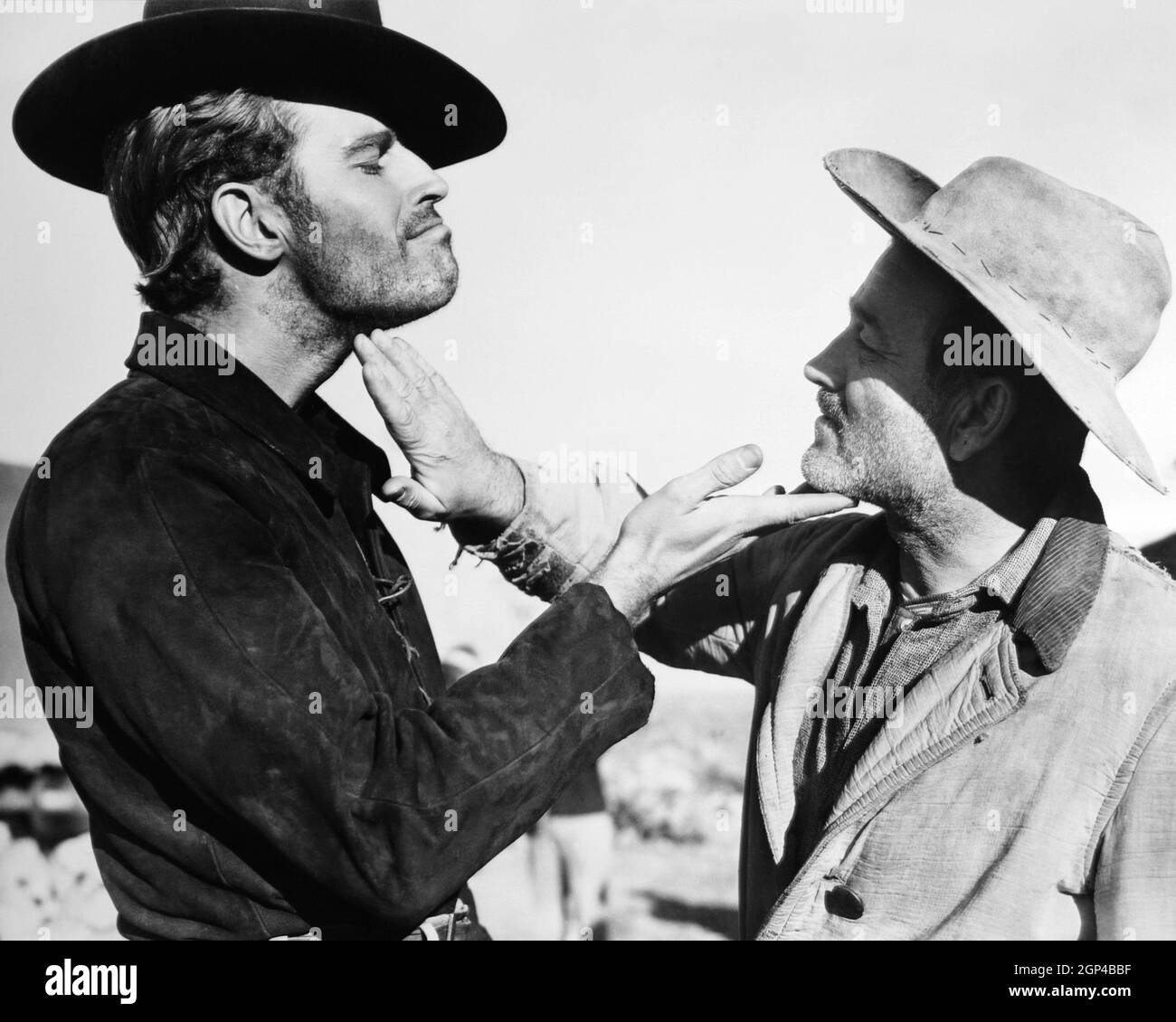 ARROWHEAD, from left: Charlton Heston, Milburn Stone on set, 1953 Stock ...