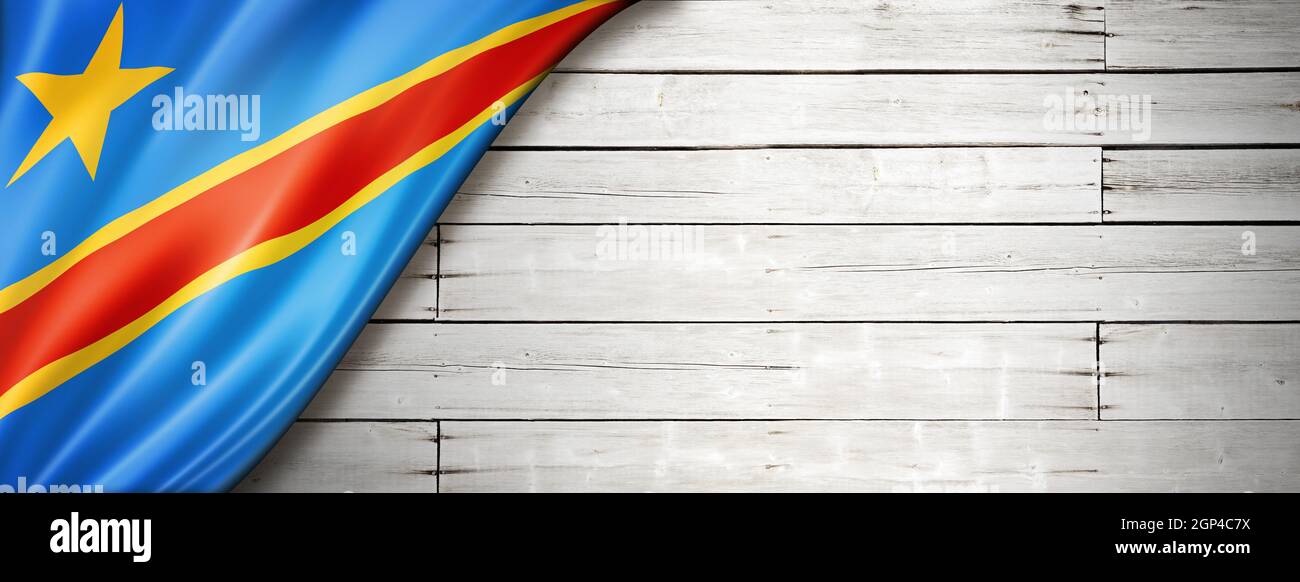 Democratic Republic of the Congo flag on old white wall. Horizontal panoramic banner. Stock Photo
