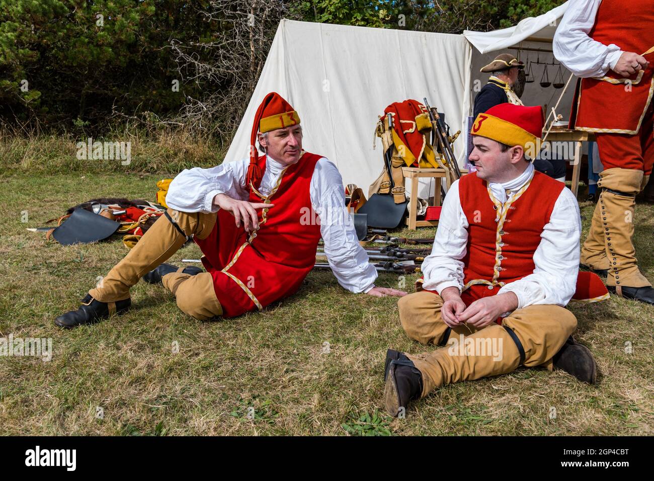 Hanoverian redcoat soldiers relax in period costume in camp re-enactment of Battle of Prestonpans, East Lothian, Scotland, UK Stock Photo