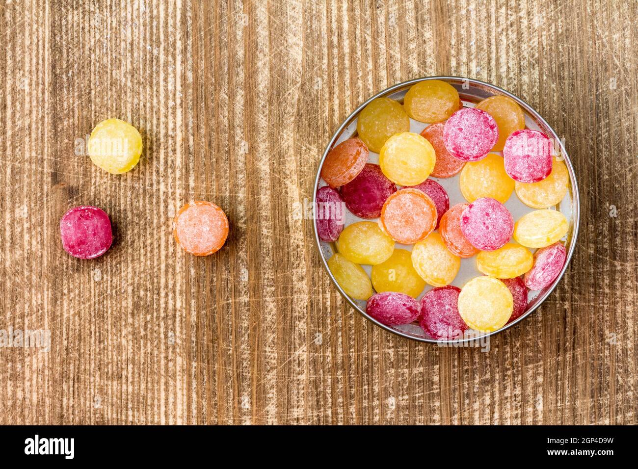 Multi colored candy in metal box, top view Stock Photo - Alamy
