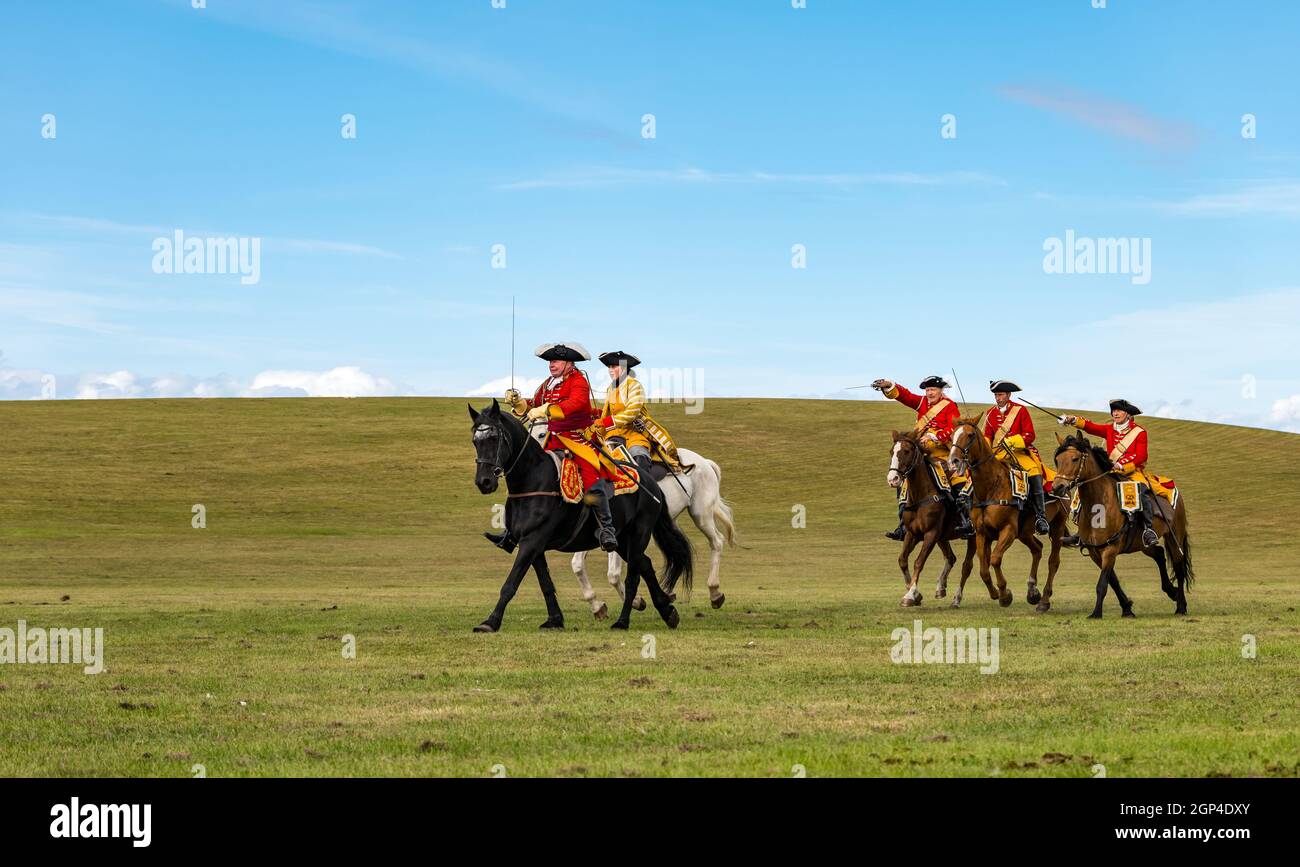Hanoverian cavalry troops on horseback in period costume in re-enactment of Battle of Prestonpans, East Lothian, Scotland, UK Stock Photo