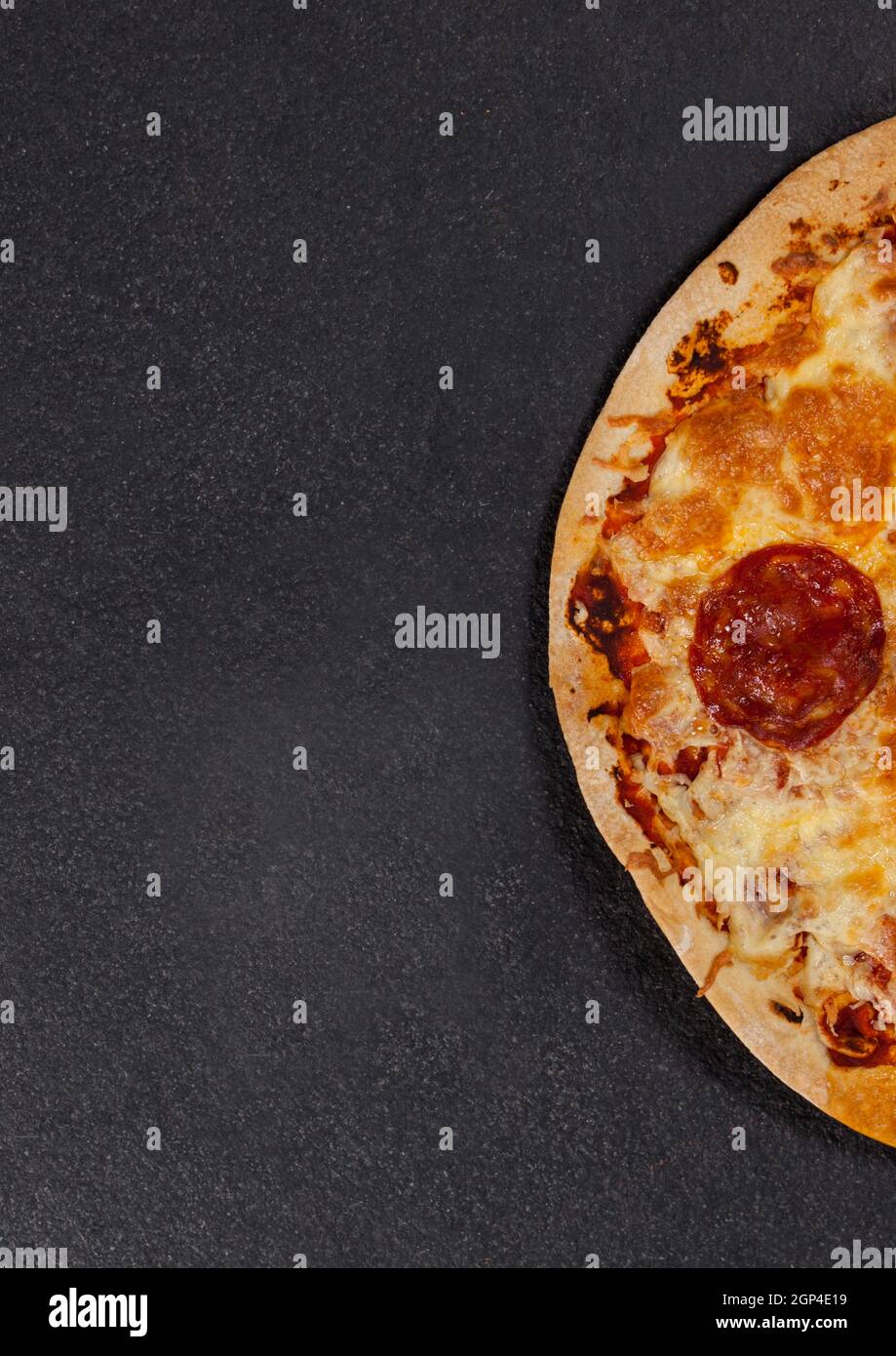 Composition of close up of fresh pizza on gray background Stock Photo