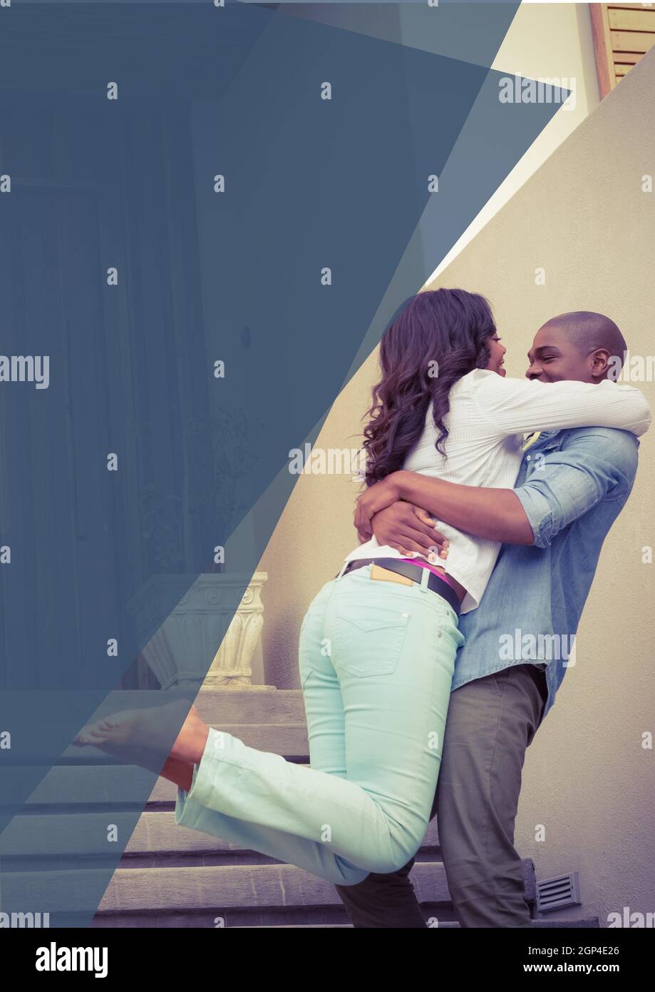 Composition of happy african american couple embracing on stairs Stock Photo