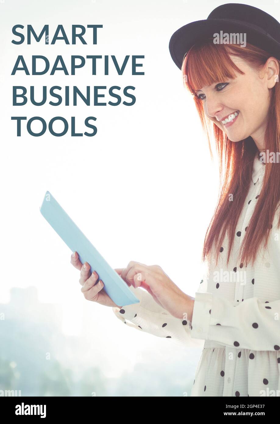 Composition of business tools text over caucasian woman using tablet and smiling Stock Photo