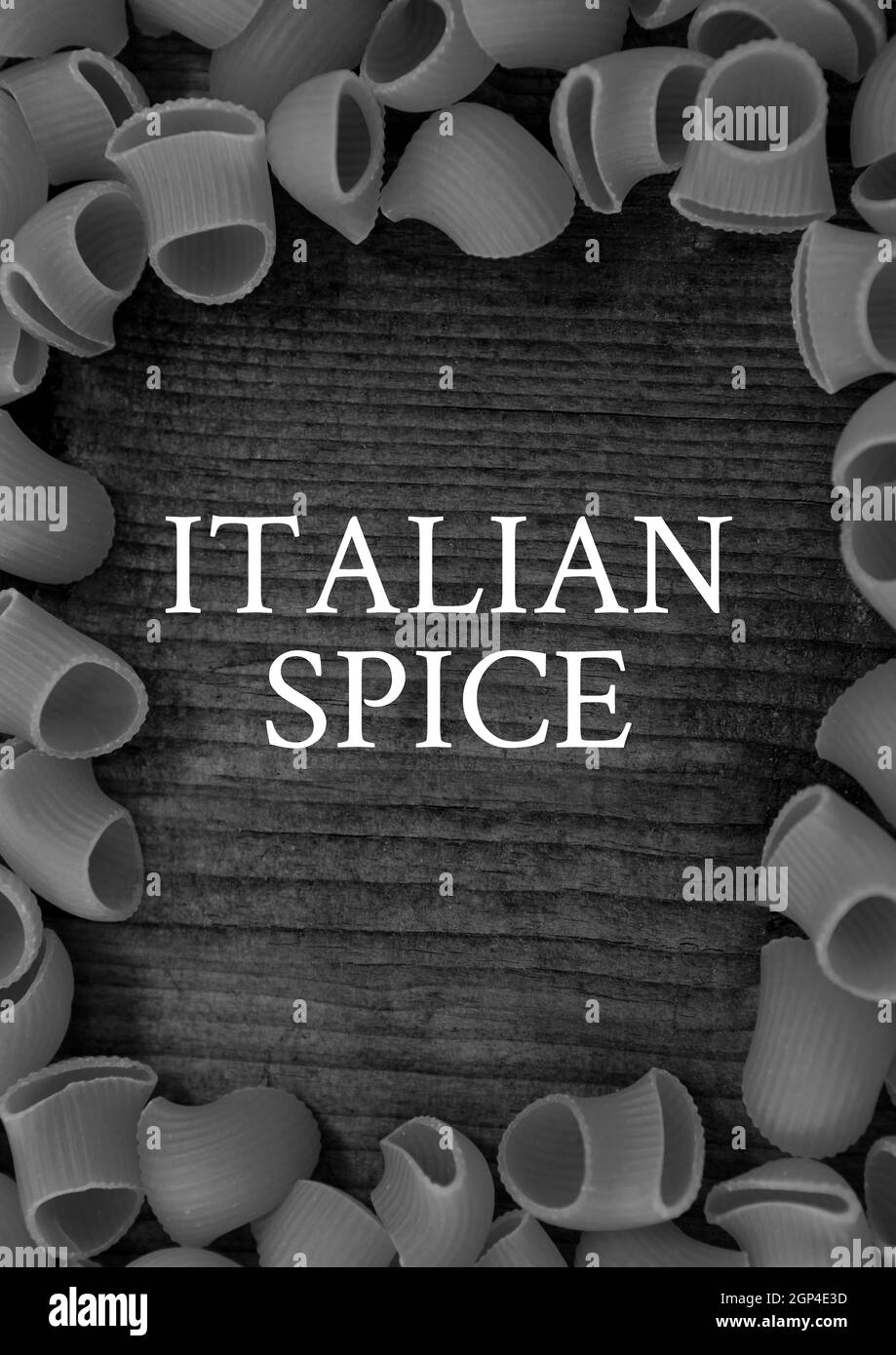 Composition of italian spice text and black and white pasta on gray background Stock Photo