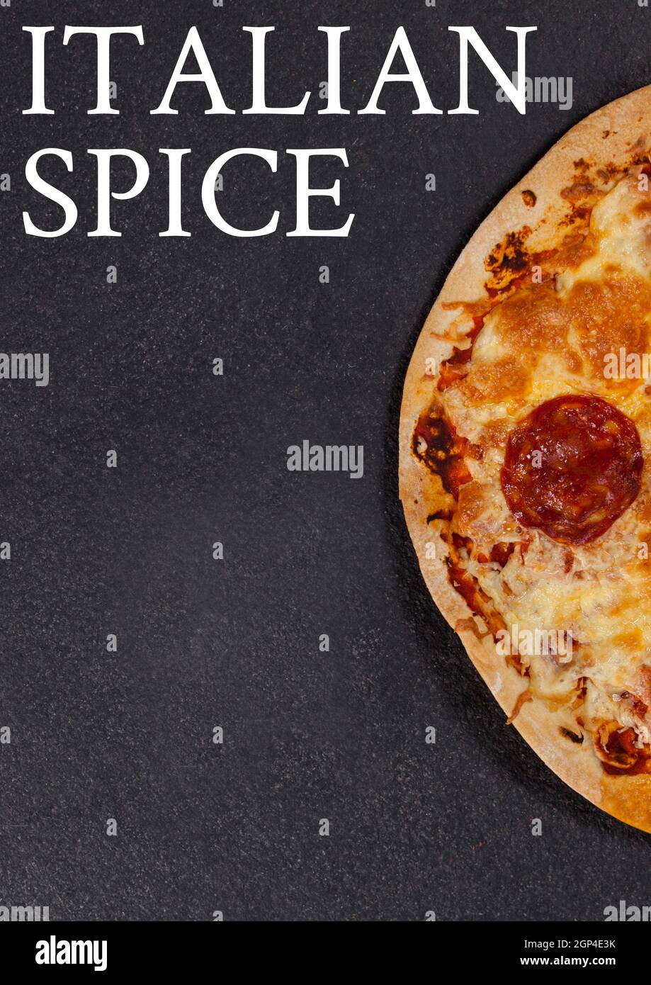 Composition of italian spice text and fresh pizza on gray background Stock Photo