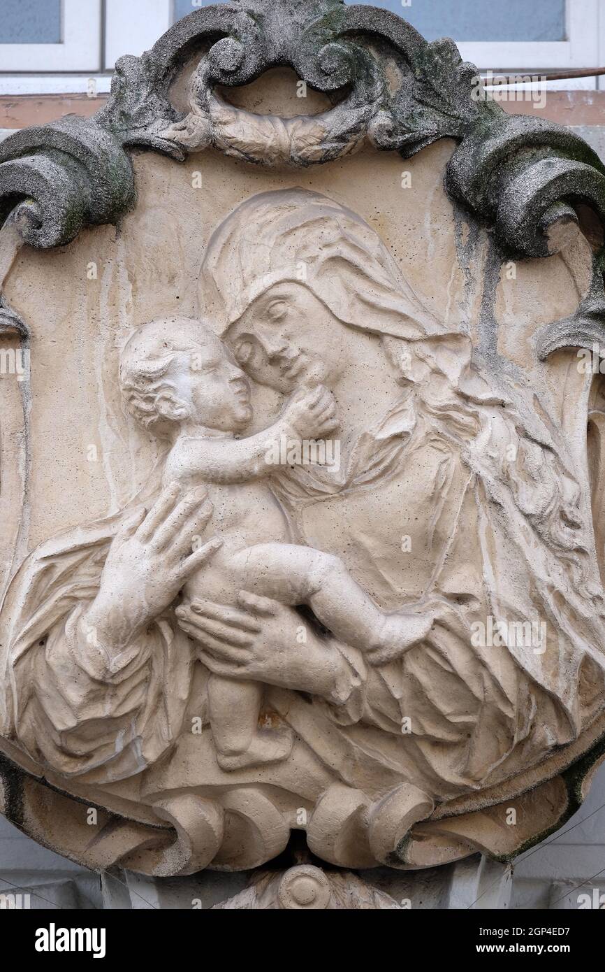 Virgin Mary with baby Jesus, statue on the house facade in Graz, Styria ...