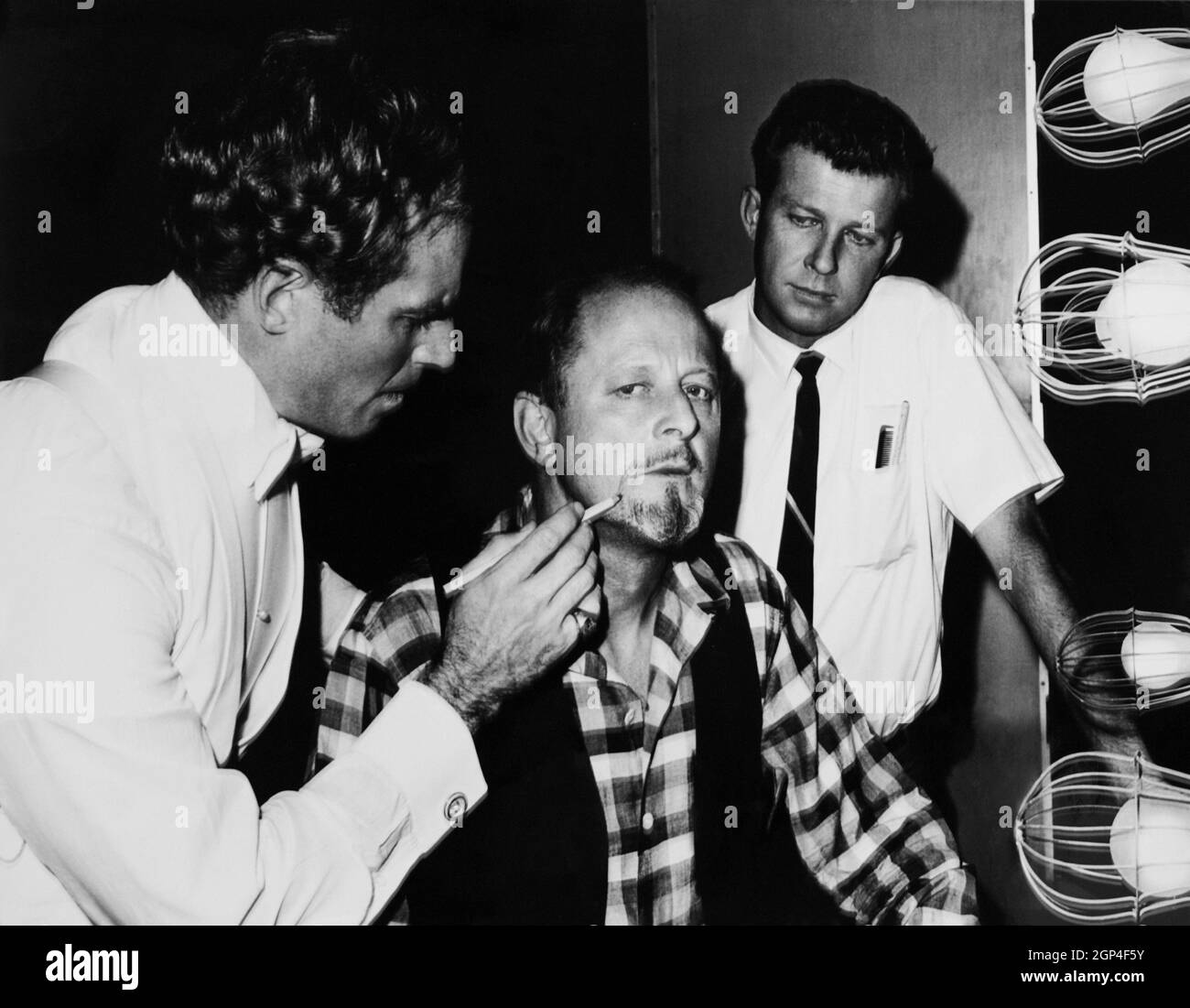COUNTERPOINT, from left Charlton Heston helps director Ralph Nelson