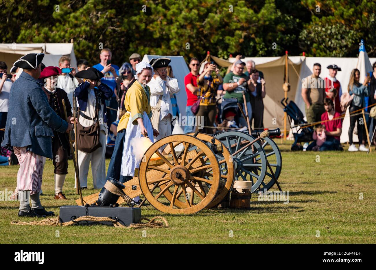 Hanoverian troops fire an artillery field gun in re-enactment of Battle of Prestonpans in period costume, East Lothian, Scotland, UK Stock Photo