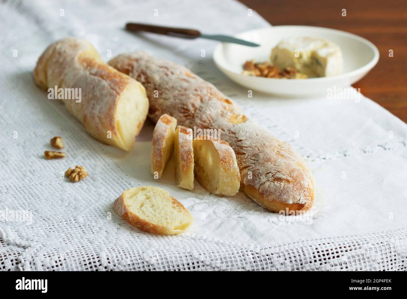 Homemade baguettes, served with blue cheese and nuts. Rustic style. Stock Photo