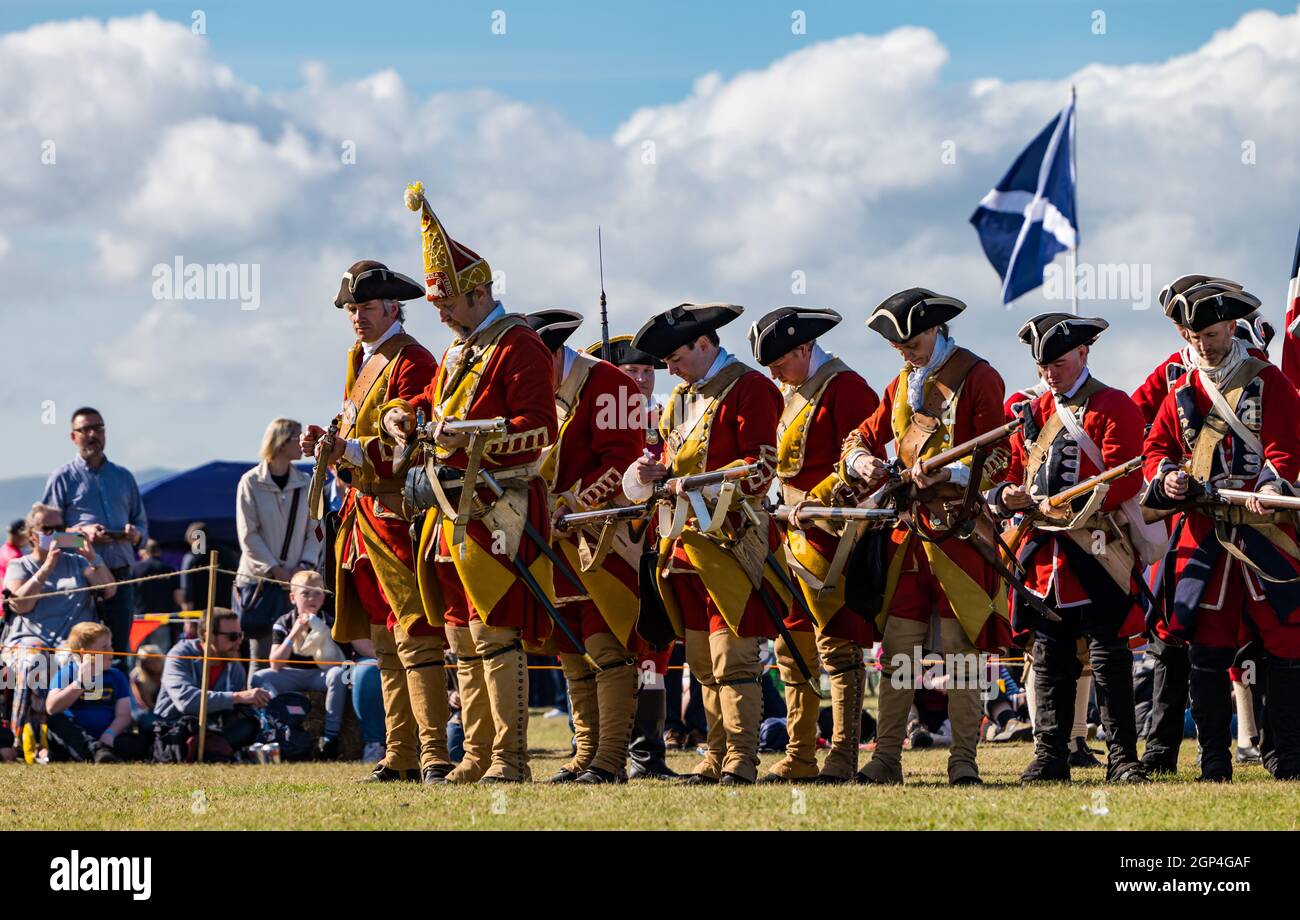 Hanoverian soldiers in period costume get ready to fire guns for re-enactment of Battle of Prestonpans , East Lothian, Scotland, UK Stock Photo