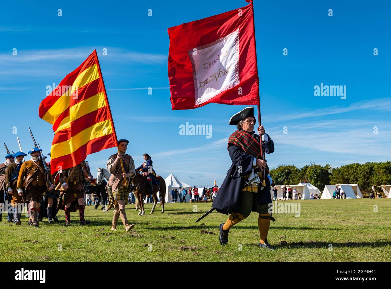 Jacobite Scotsmen in period costume march with flags in re-enactment of Battle of Prestonpans , East Lothian, Scotland, UK Stock Photo