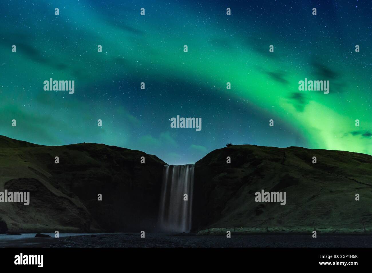 ICELAND. SKOGAFOSS, A NORTHERN LIGHT ABOVE THE SKOGAFOSS WATERFALL. Stock Photo