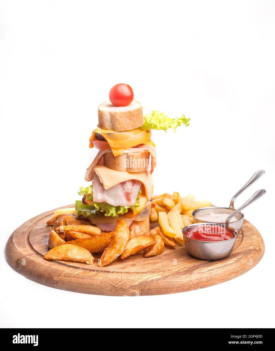 fast food set of big hamburger and fries on a light background. Food is unhealthy. Hamburger on a white background. Close-up. Stock Photo
