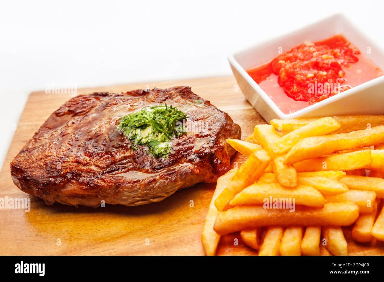 fast food set of big hamburger and fries on a light background. Food is unhealthy. Hamburger on a white background. Close-up. Stock Photo