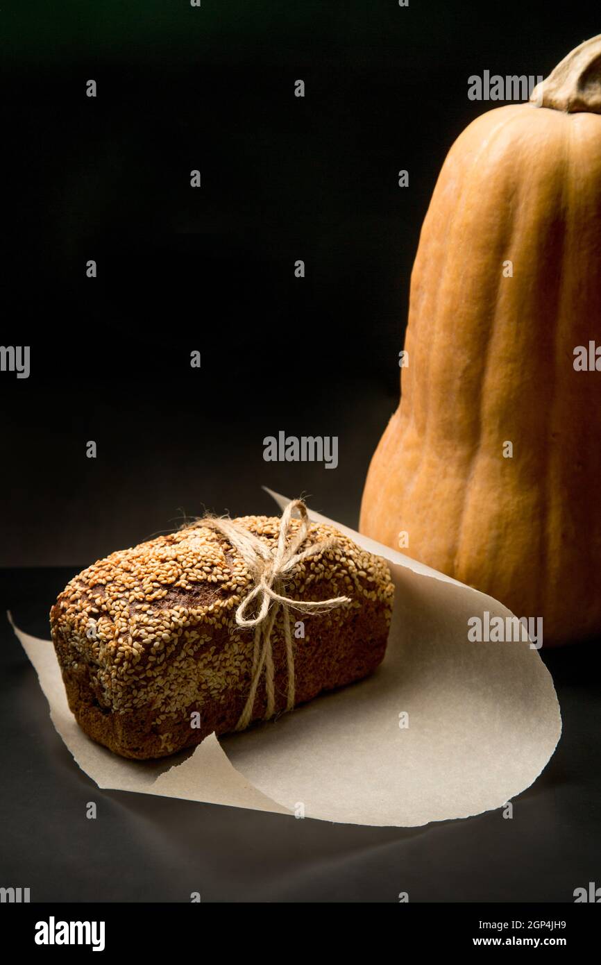 Homemade square bread with sesame seeds. Adding glutenfree flour
