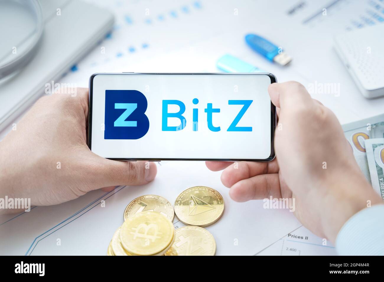 Russia Moscow 20.05.2021 BitZ logo in mobile phone.Cryptocurrency  decentralized exchange DEX.Trading blockchain platform.Swap,buy,sell crypto  token,di Stock Photo - Alamy