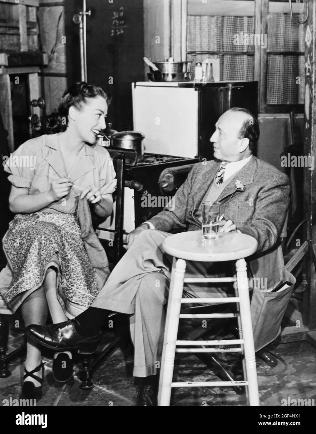 MILDRED PIERCE, from left: Joan Crawford, director Michael Curtiz on set, 1945 Stock Photo
