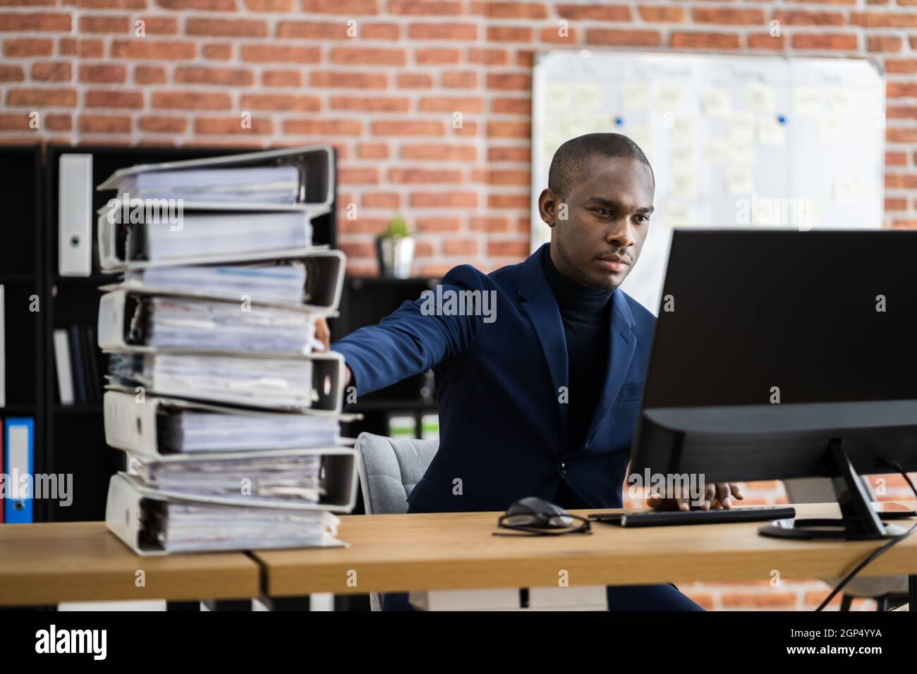 Digital Transformation. Accountant Using E Invoice Tax Document Software Stock Photo