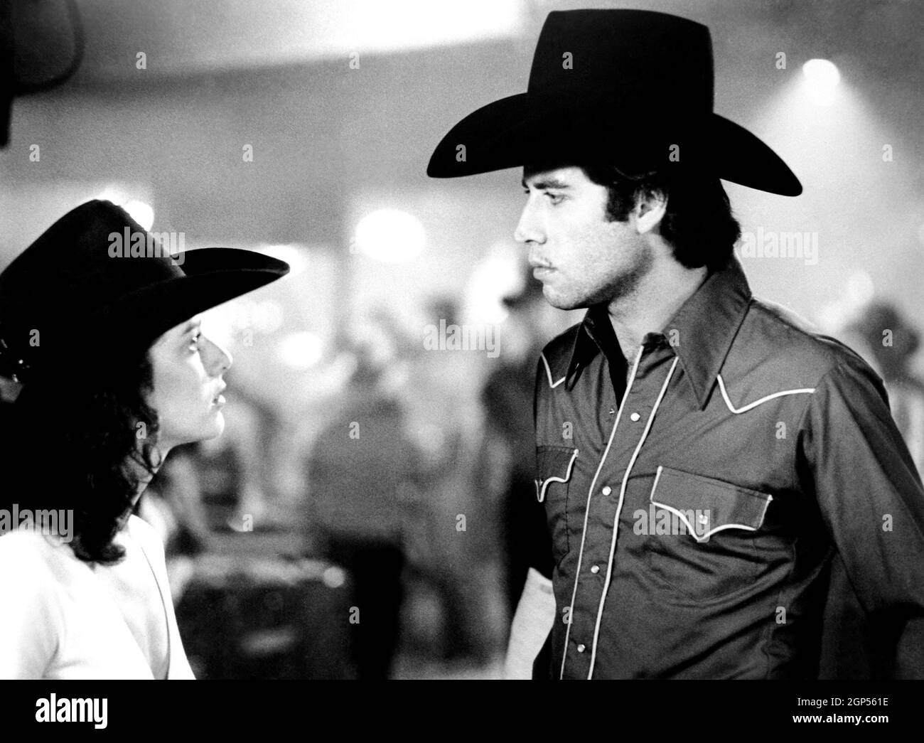 URBAN COWBOY, from left, Debra Winger, John Travolta, 1980,  ©Paramount/courtesy Everett Collection Stock Photo - Alamy, image size:1300x1045