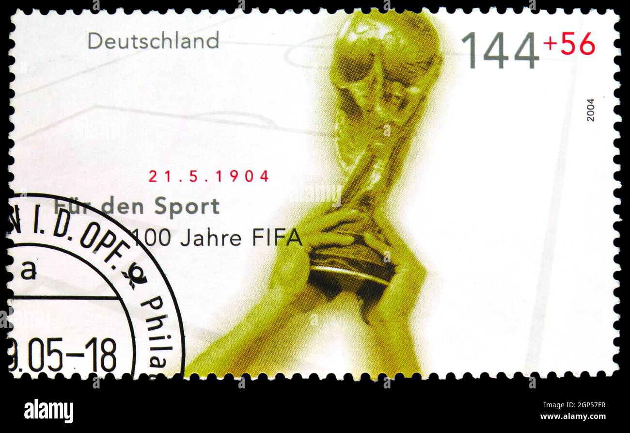 MOSCOW, RUSSIA - AUGUST 5, 2021: Postage stamp printed in Germany shows Fifa World Cup Trophy, serie, circa 2004 Stock Photo