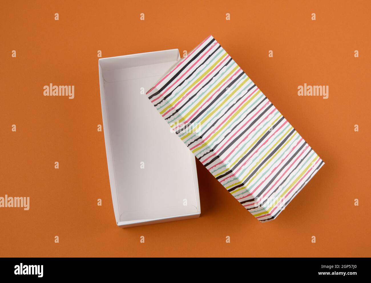 open rectangular cardboard blank box on brown background, top view Stock Photo