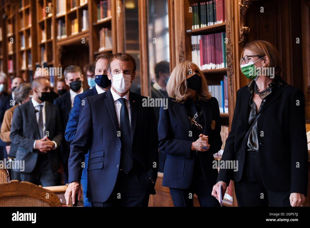 French President Emmanuel Macron, his wife Brigitte Macron and President of  the Bibliotheque Nationale de France Laurence Engel (R) visit the Richelieu  site of the Bibliotheque Nationale de France, after the completion