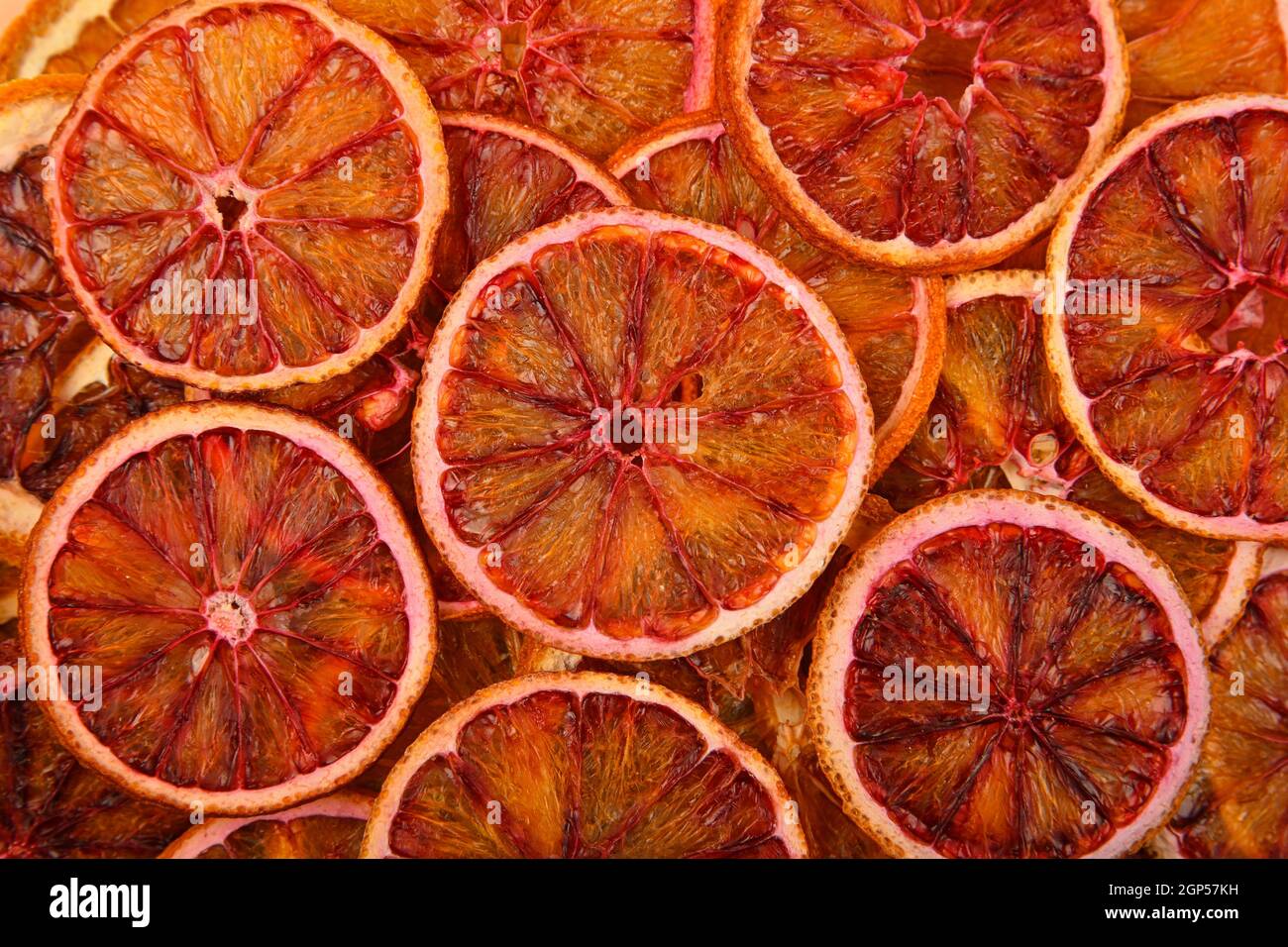 Close up many dried crispy red blood orange ring chips on retail ...