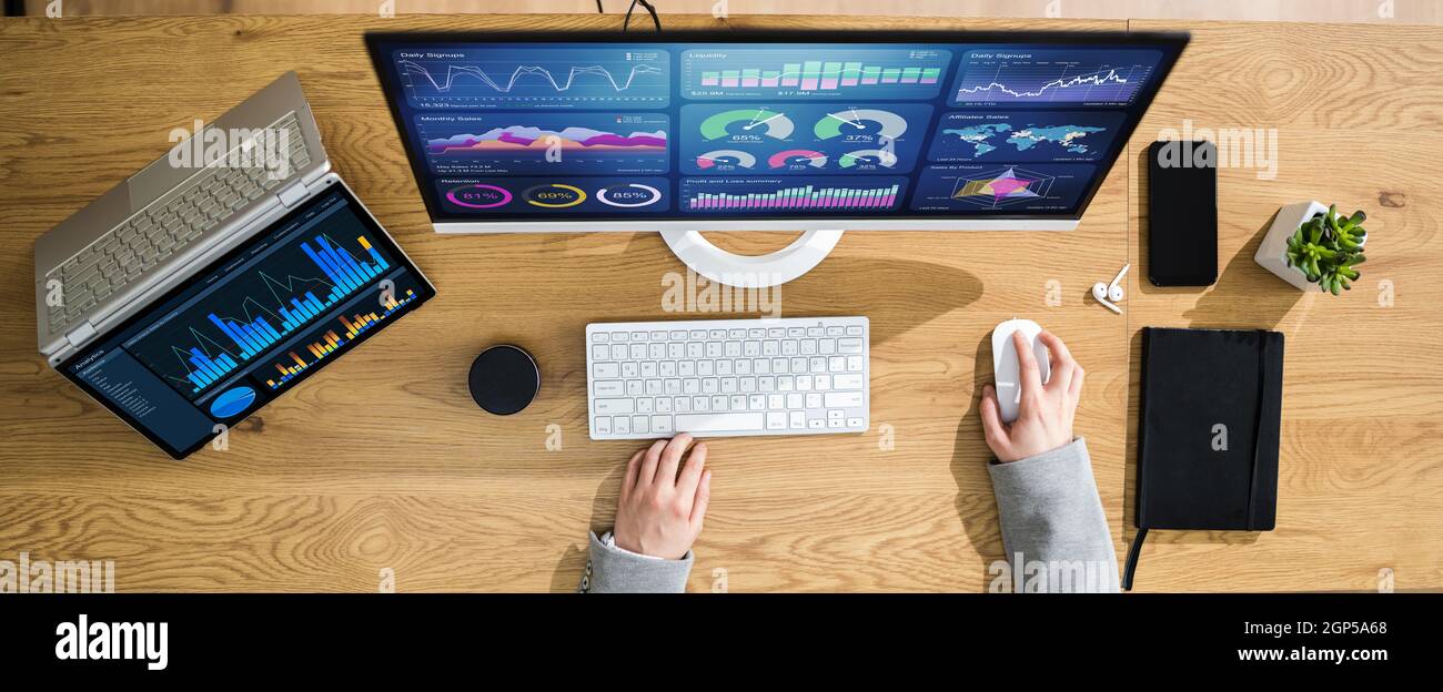Business Woman Analyst Using KPI Data On Computer Stock Photo