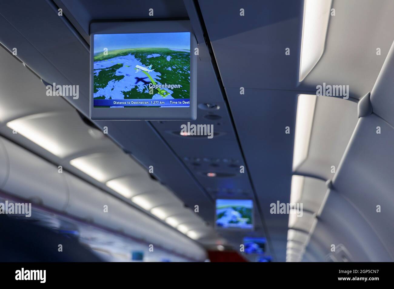 Monitor inside an air plane cabin showing aircraft flight position map on TV screen after departure from Copenhagen Airport Kastrup, Copenhagen, Denma Stock Photo