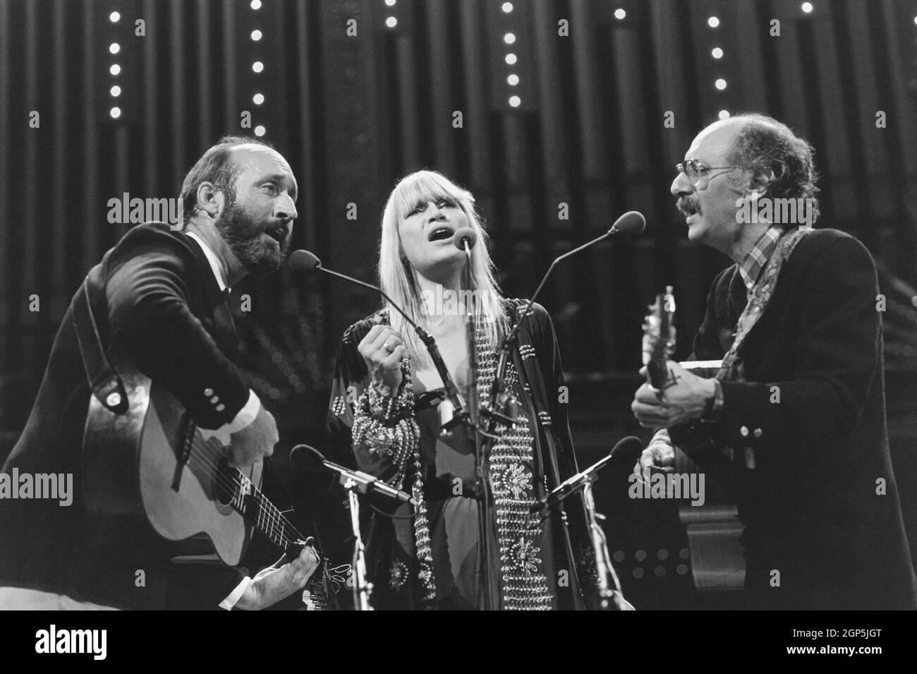 Folk group Peter, Paul and Mary, (from left: Noel Paul Stookey, Mary Travers, Peter Yarrow) in concert, circa 1987. Michael Lutch / TV Guide / courtesy Everett Collection Stock Photo