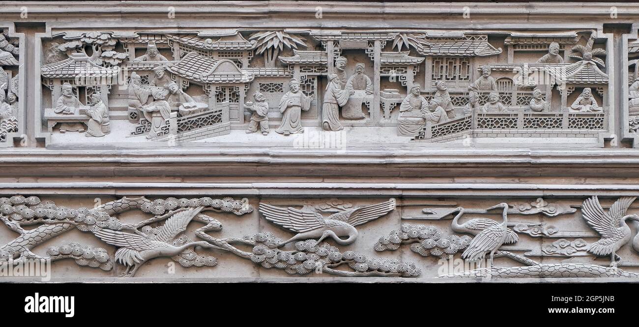 Richly carved stone bas-relief plaque on the doorway of the house in the Grand Canal, ancient town of Yuehe in Jiaxing, Zhejiang Province, China Stock Photo