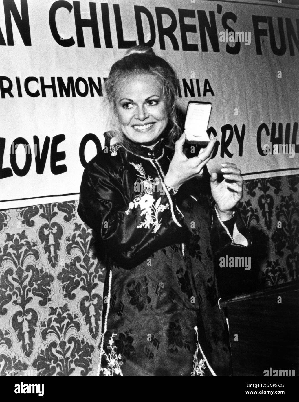 Sally Struthers accepts pin symbolizing her election as National