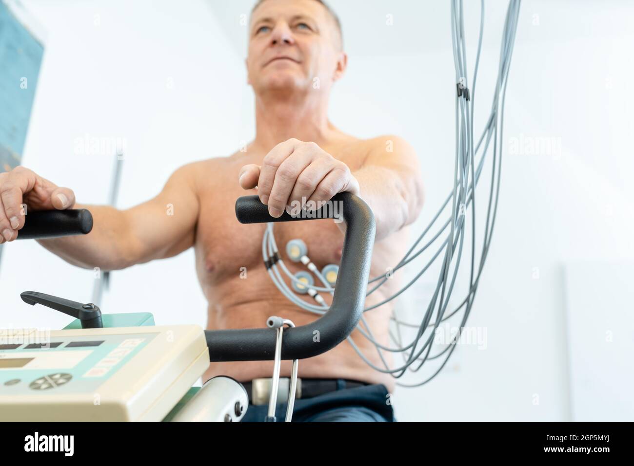 Patient during exercise ECG on stationary bike Stock Photo