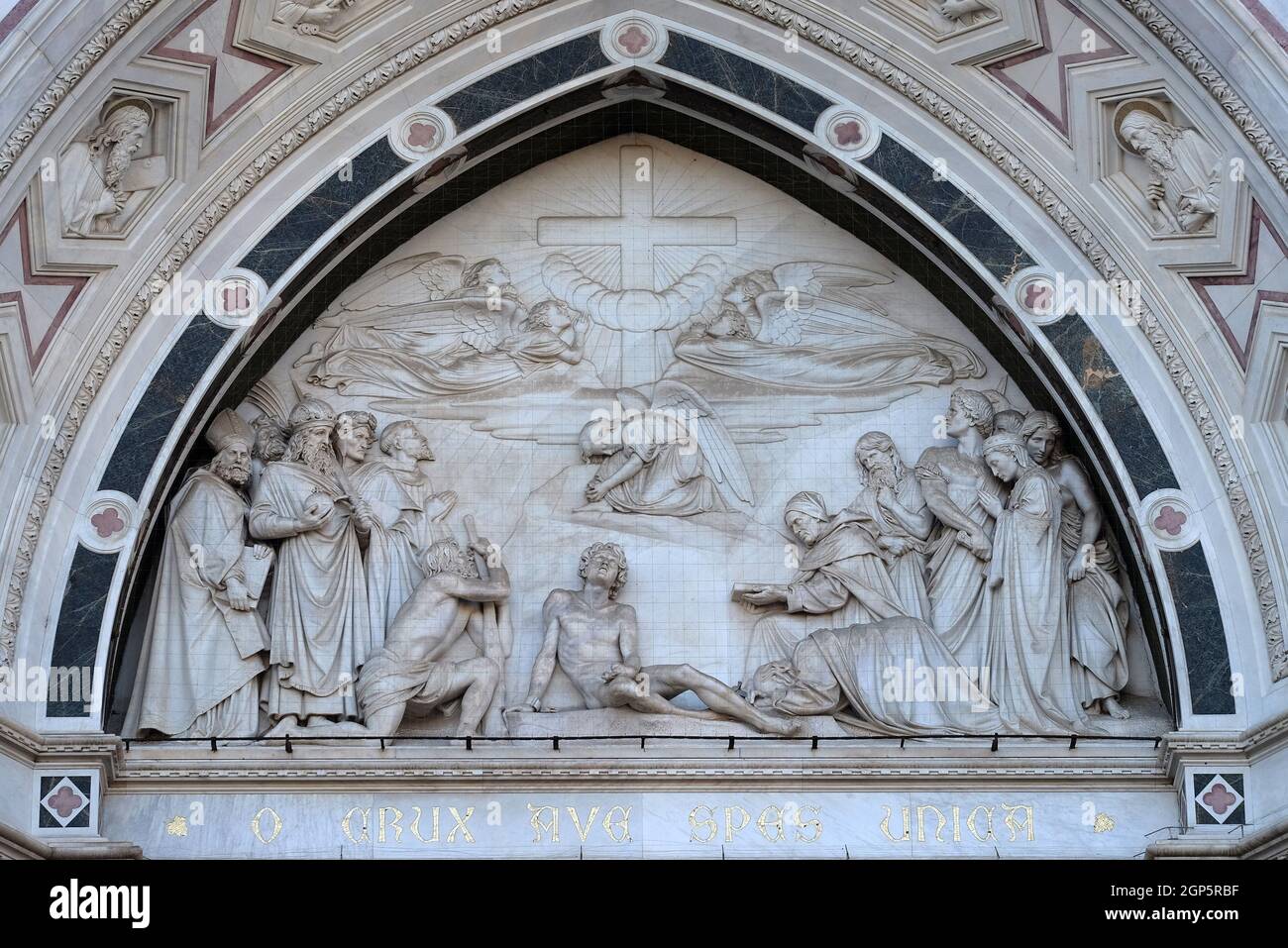 Sculpted lunette containing a relief of the Triumph of the Cross, by Giovanni Dupre, over the central door of the of Basilica of Santa Croce (Basilica Stock Photo