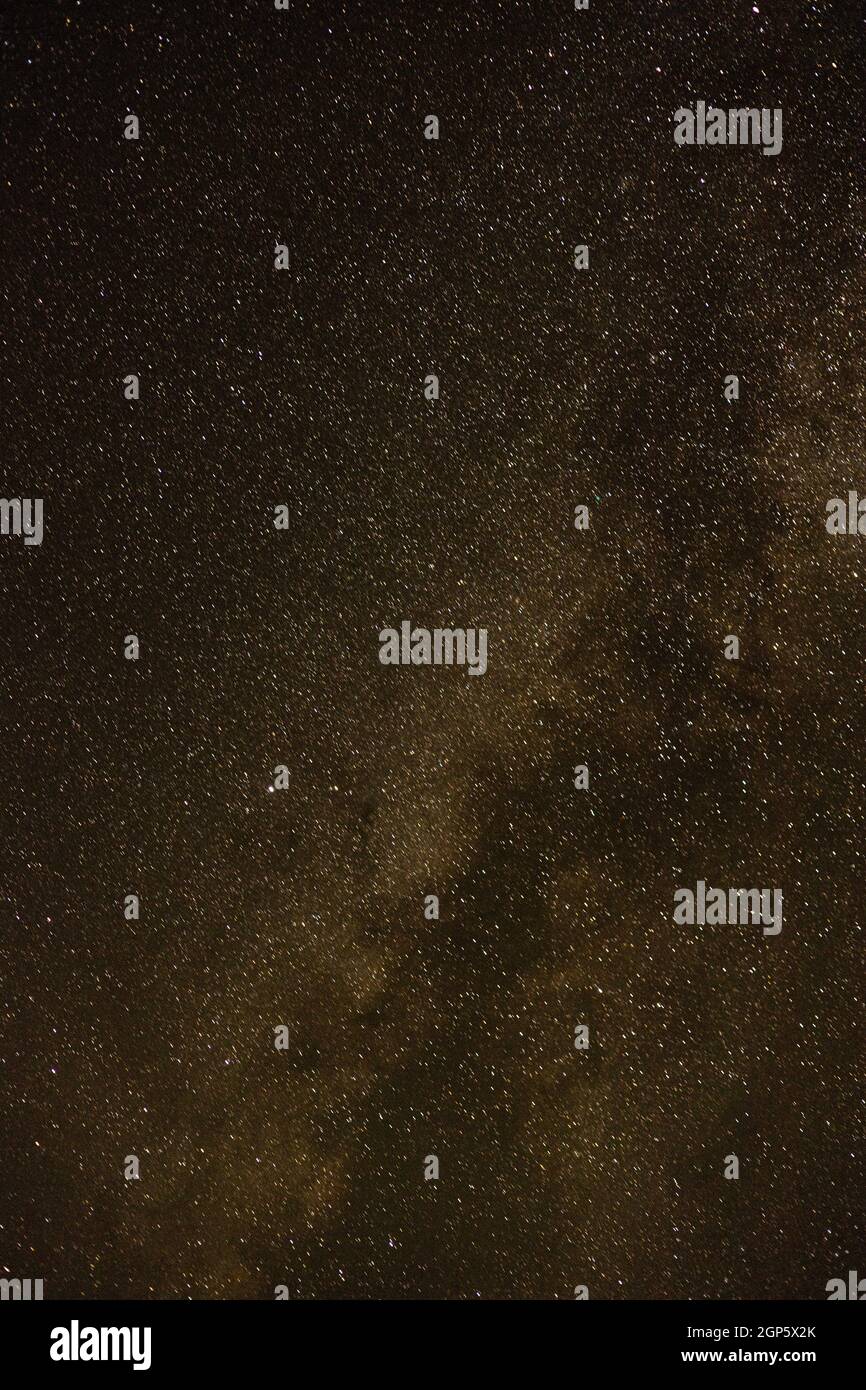 Burst of golden stars in the milky way against a dark night sky Stock ...