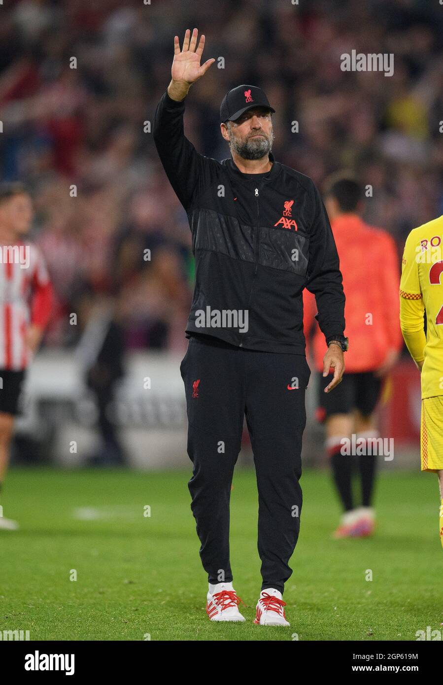 25 September 2021 - Brentford v Liverpool  - The Premier League - Brentford Community Stadium  Liverpool Head Coach Jurgen Klopp salutes the fans afte Stock Photo