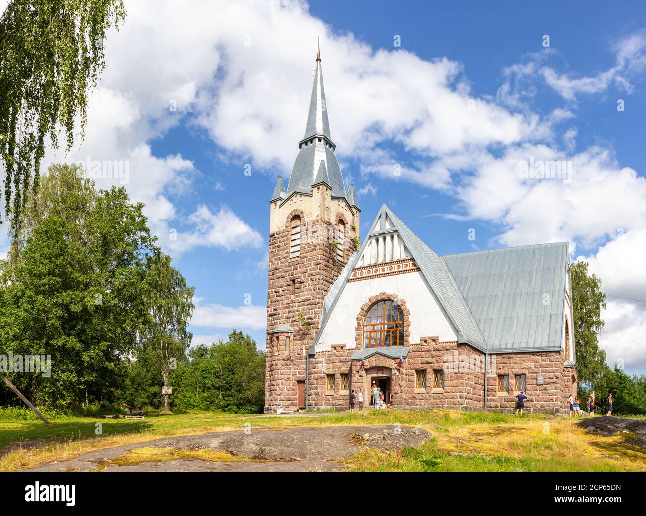 Old church kirk Raislya designed by architect Joseph Stenback in 1912 in style of Finnish national romanticism, northern variety of Art Nouveau in sun Stock Photo