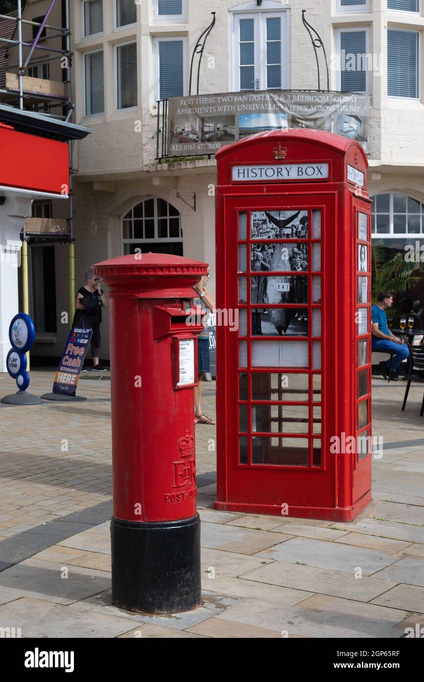 Old telephone box which is now a history box. Stock Photo