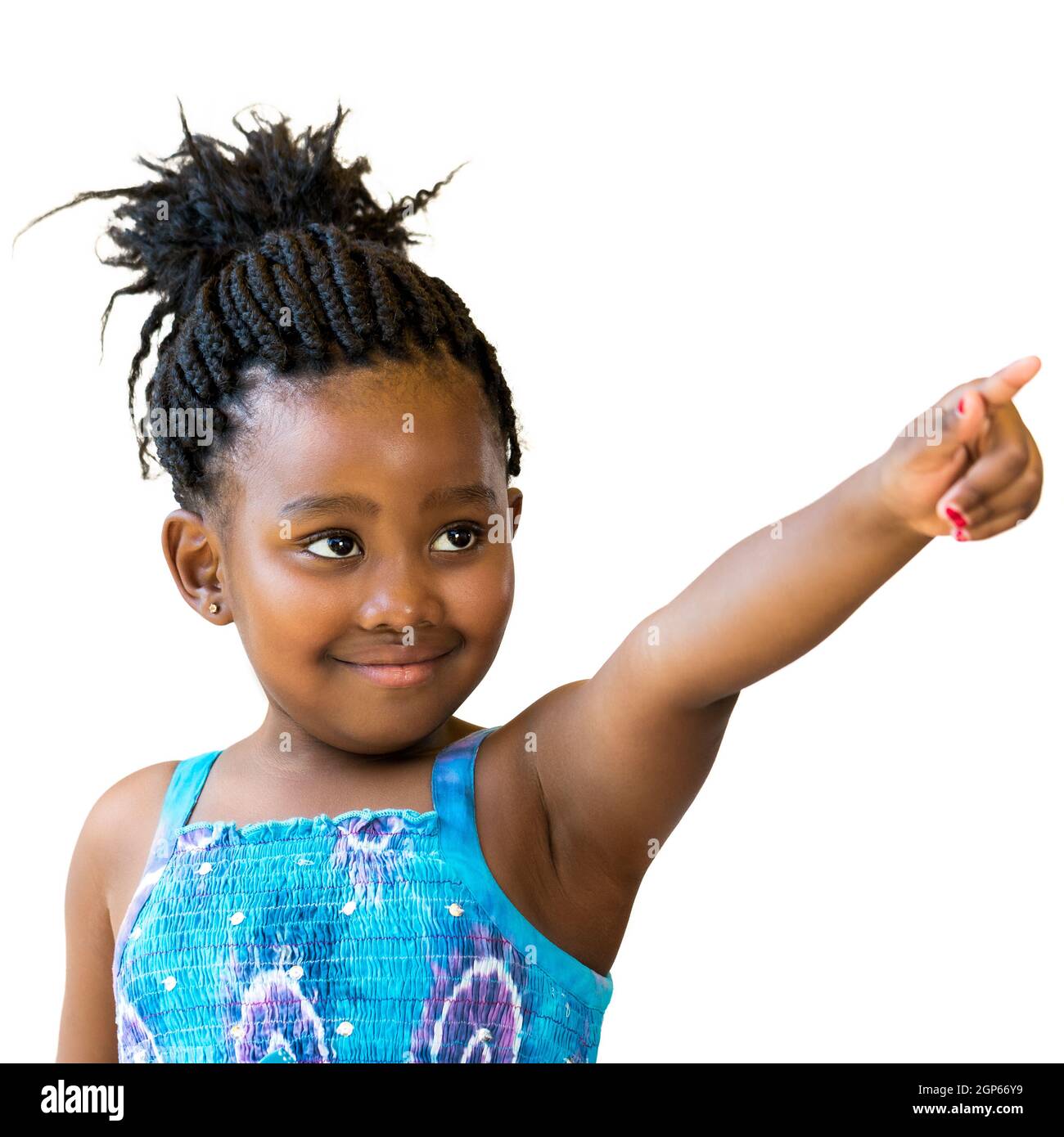 Close up portrait of cute african girl with braided hair pointing with finger at corner.Isolated on white background. Stock Photo