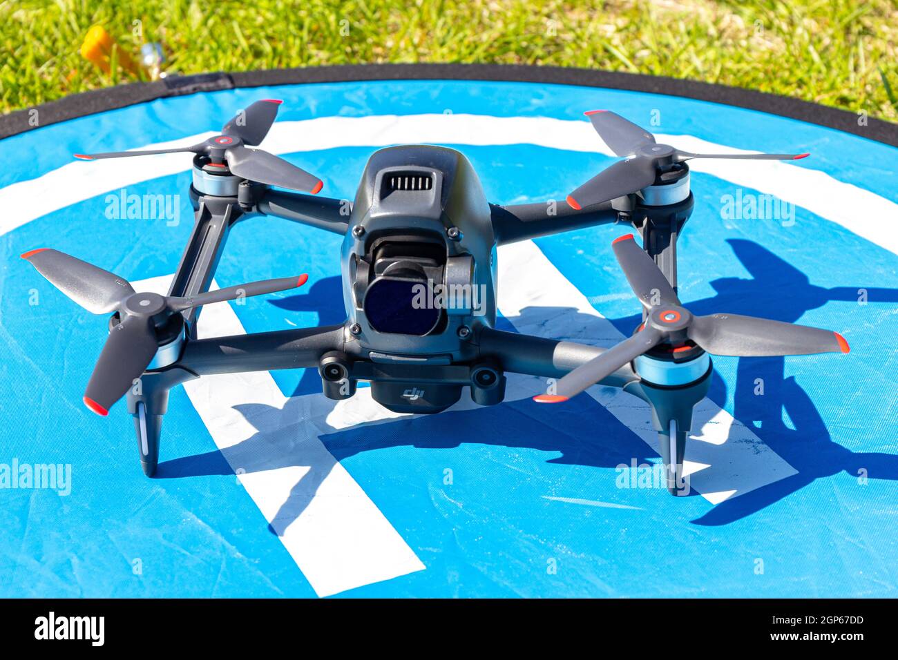 Moscow Russia - 30 may 2021: Close-up picture new aerial DJI FPV drone on fly landing pad. Top front view uav quad copter with 4K 60 fps Digital Camer Stock Photo