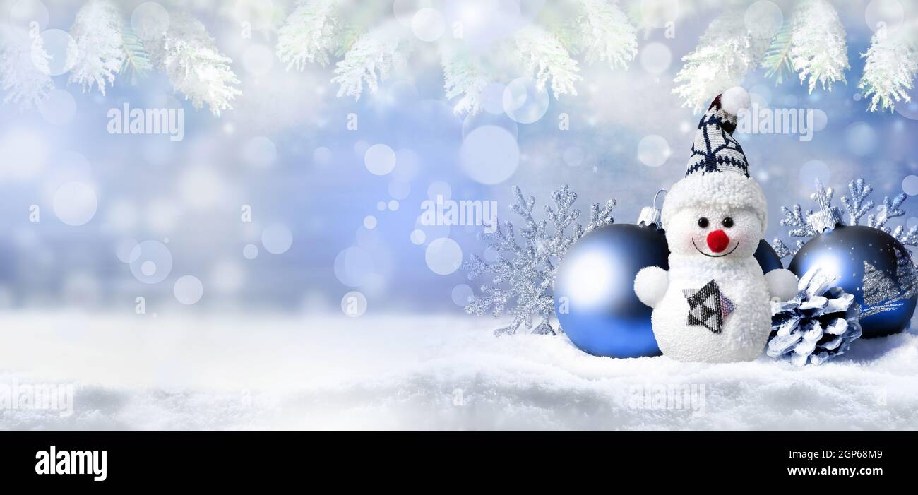 Christmas background with snow, balls and snowman Stock Photo - Alamy