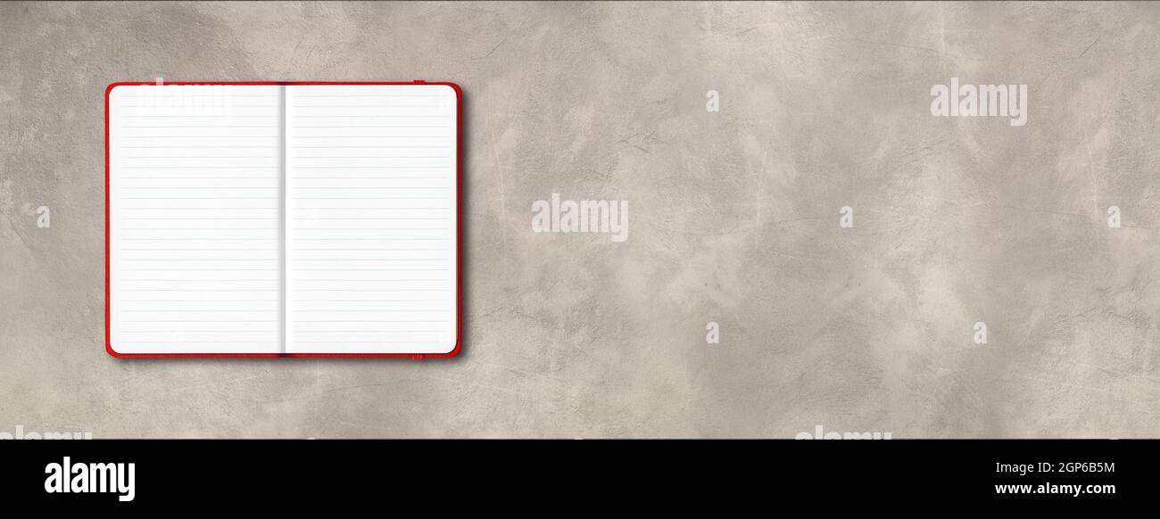 Red open lined notebook mockup isolated on concrete background. Horizontal banner Stock Photo
