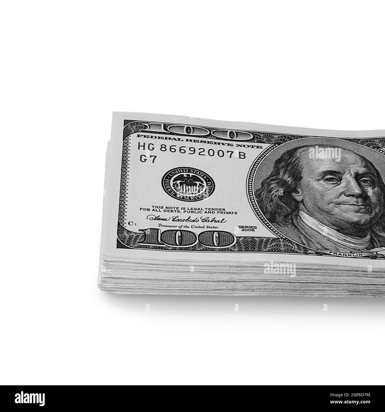 A large stack of hundred-dollar cash bills on a white background. Isolated. Layout, mockup, place for lettering and logo. Stock Photo
