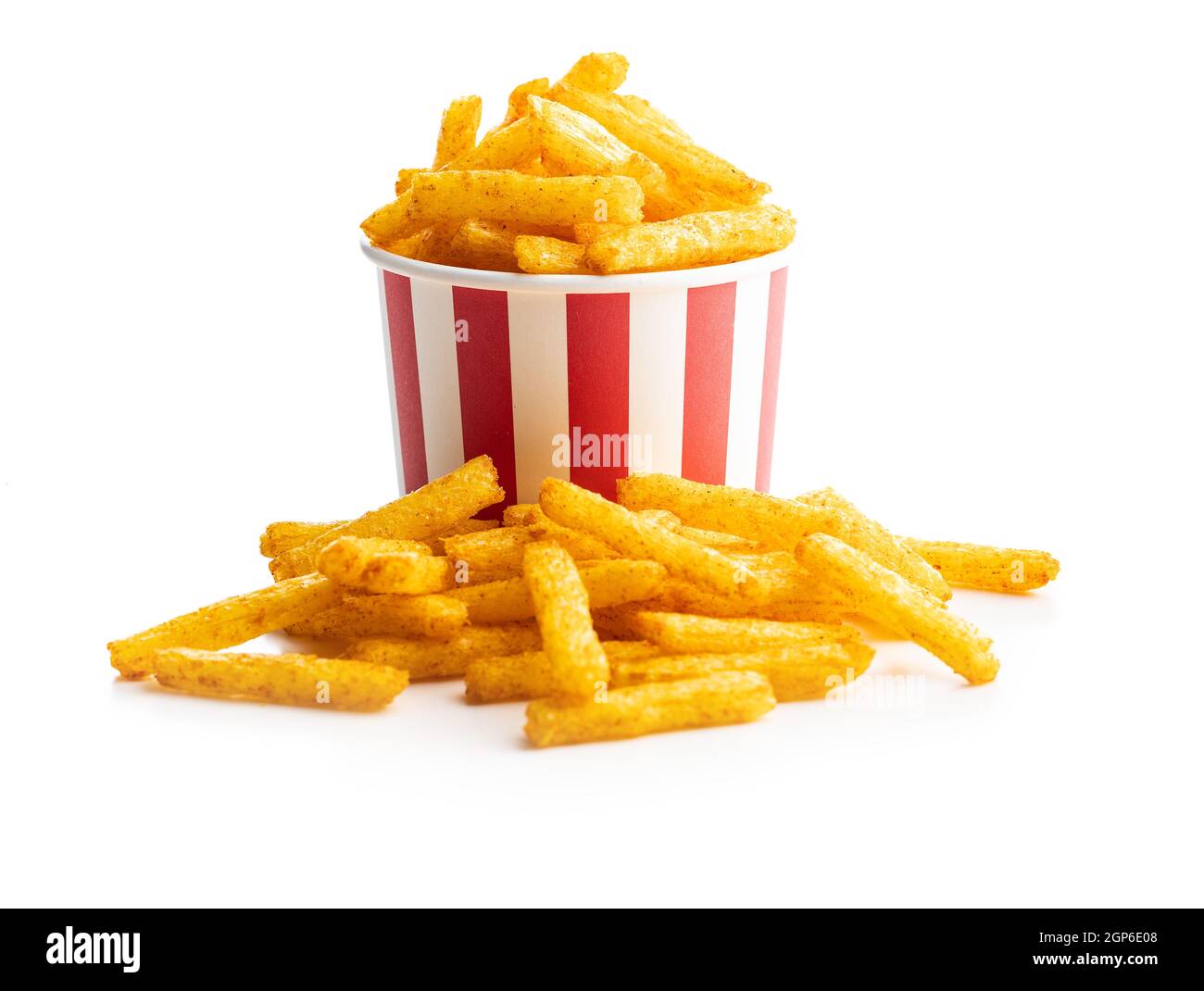 French fries. Salted snack. Potato chips in paper cup isolated on white background. Stock Photo
