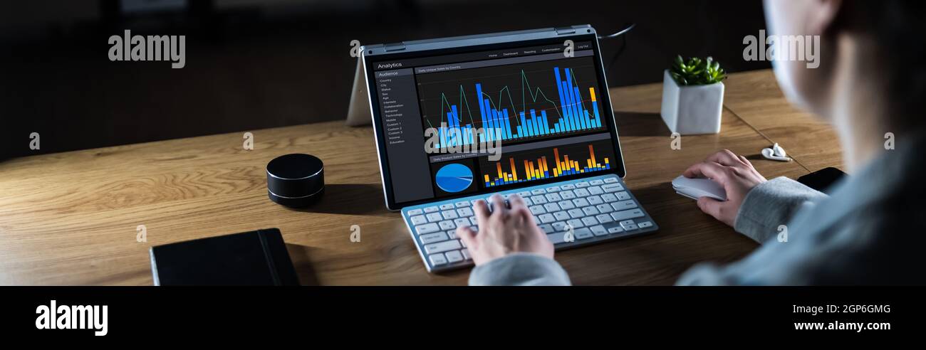 Business Woman Analyst Using KPI Data On Computer Stock Photo