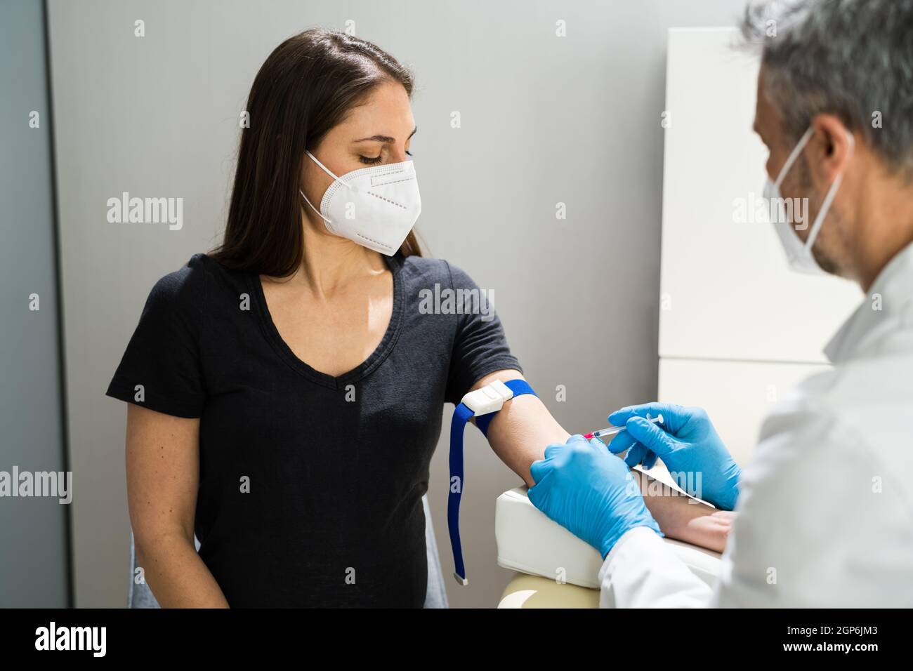 Woman donating blood mask hi-res stock photography and images - Alamy