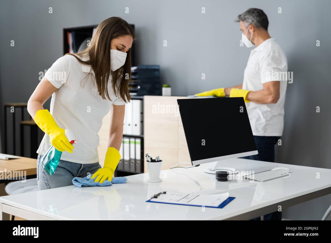 Cleaning Service Janitor Cleaner With Mop In Face Mask Stock Photo