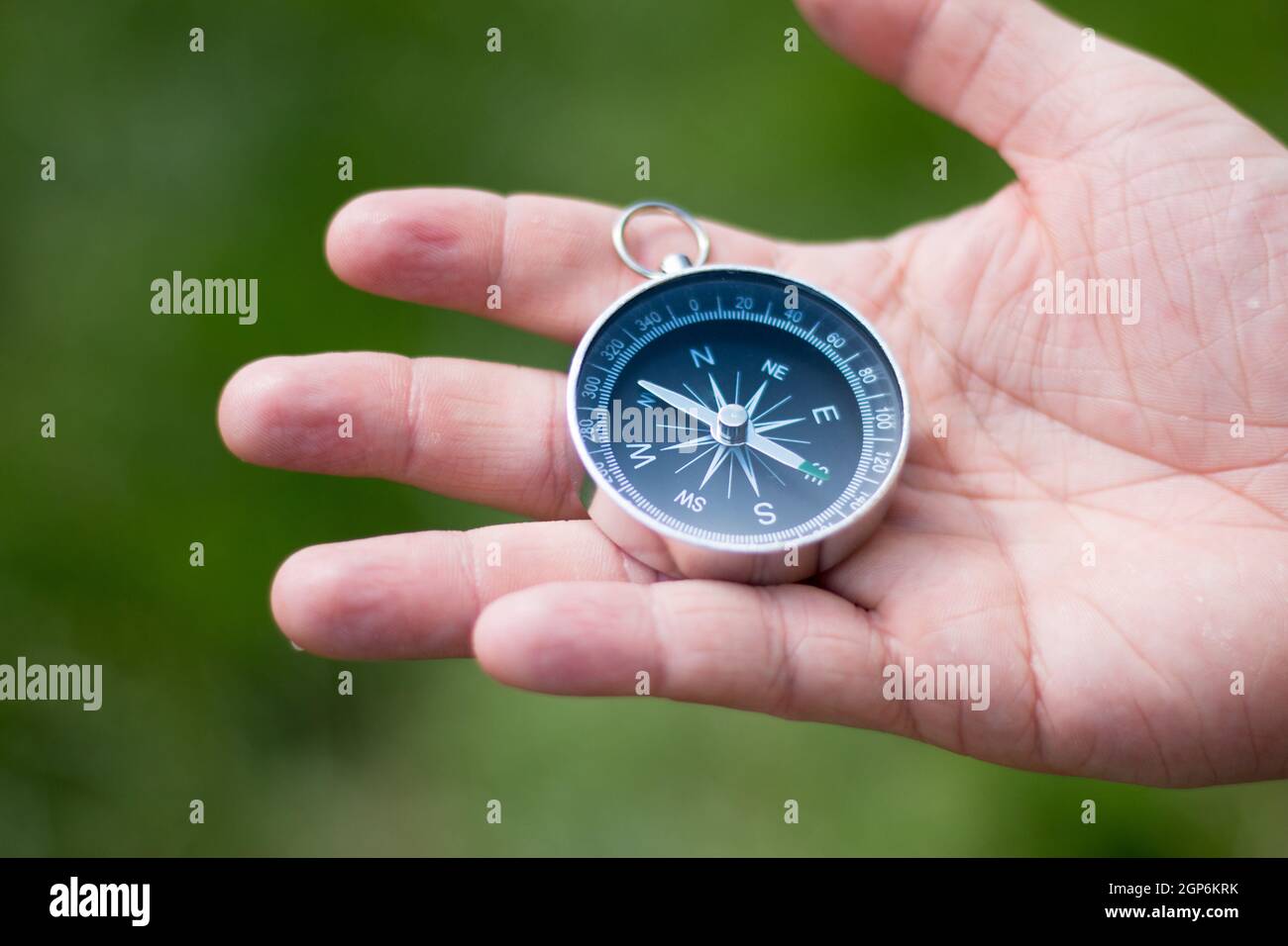 Vintage compass in man’s hand, adventure and discovery concept Stock ...