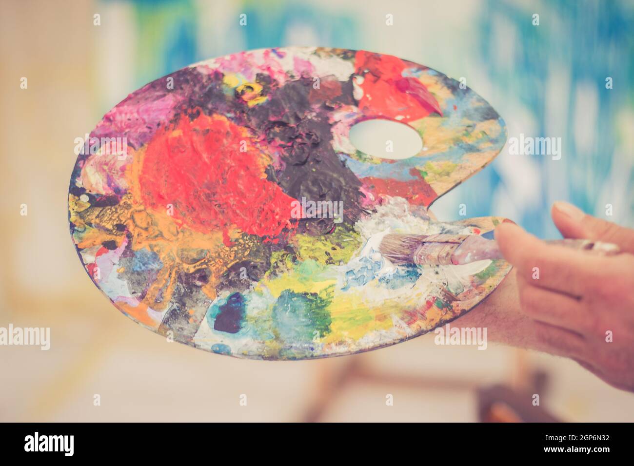 Artist holding colorful color palette. Painting therapy Stock Photo Alamy